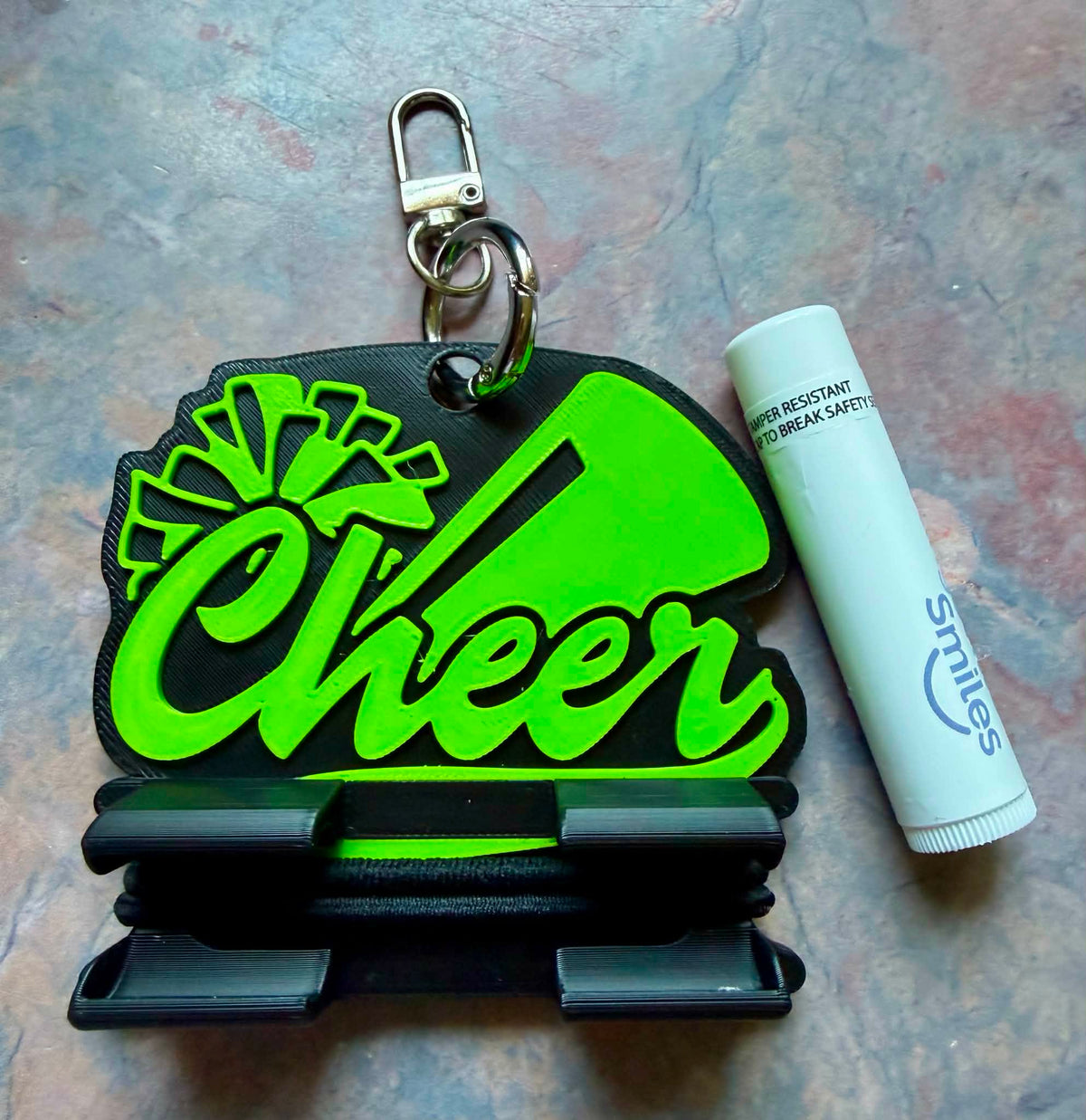 Cheer chap stick/hair tie holder